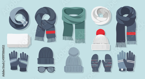Winter clothing items on light blue