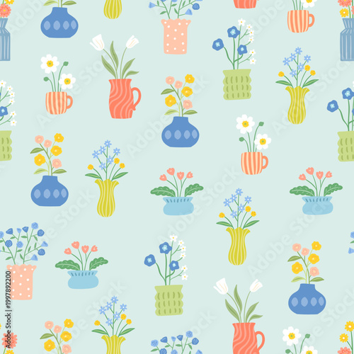 cute flowers in decorative vases