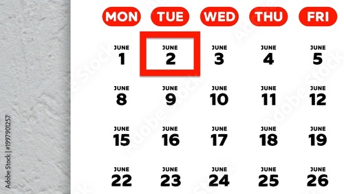 Close-up of the date June 2nd marked with a red cursor on the wall calendar 2026