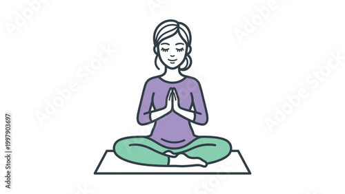 A woman sits cross-legged on a mat in a yoga pose with hands together.