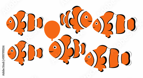 Six Clownfish Swimming Around an Orange Balloon