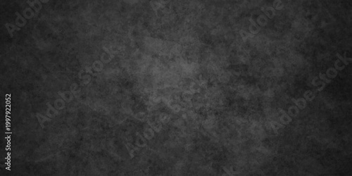 Dark charcoal grunge wall texture background. Dark black rough grunge surface with smoke edge. Black texture chalk board and black board.