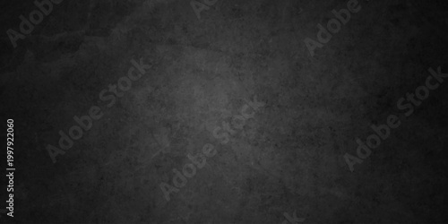 Dark charcoal grunge wall texture background. Dark black rough grunge surface with smoke edge. Black texture chalk board and black board.