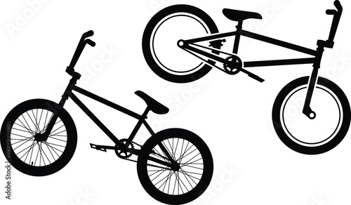 Two black silhouette BMX bicycles isolated on white background silhouette vector design