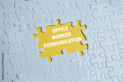 Foto Piece of jigsaw puzzle with word office worker communication.