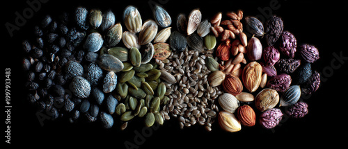 Seed assortment mix black background macro food texture, colorful organic kernel and nut on dark studio backdrop, healthy snack concept