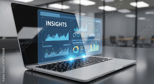 Modern laptop displaying data analytics and insights with a futuristic holographic interface