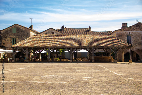 Historic wooden market hall in the medieval square of Monpazier