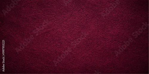 A rough red leather surface featuring a vintage grunge texture and weathered material pattern creates a blank old textile backdrop suitable for a wallpaper design