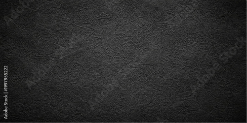A dark textured black leather surface with a rough macro pattern and grunge textile structure creates a blank material backdrop for a professional design wallpaper