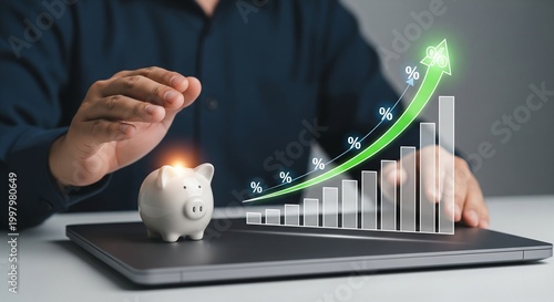 Piggy bank and growing financial graph with upward arrow on laptop, business growth concept