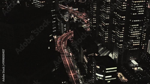 Night in Tokyo : Overlooking the City, The Metropolitan Expressway Winds through Densely Packed Skyscrapers with a Warm Glow  |  Shuto Expressway, Shinjuku, Tokyo, Japan