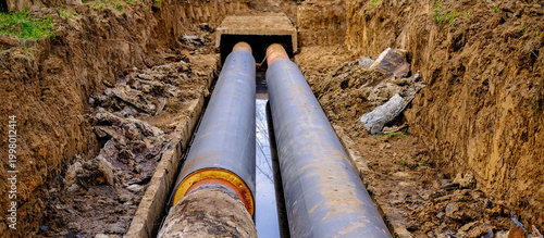 Fotografie Repair and replacement of underground heating pipeline with insulated pipes in trench