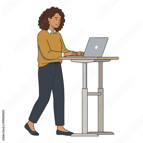A woman works on her laptop standing at a desk indoors.
