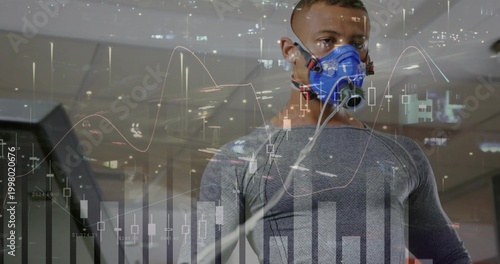 Fotografija Running athlete wearing grey tight top, blue metabolic mask and tubes on treadmi