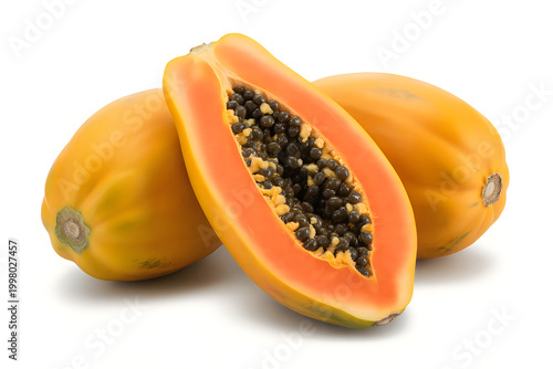 Three ripe papayas with one halved showing orange flesh and black seeds