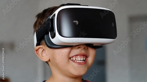 Tracking shot of young boy wearing virtual reality headset laughing and reacting inside home living room interior