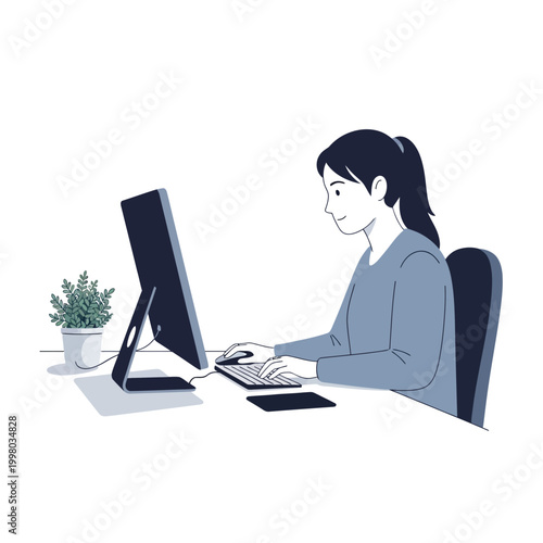 A young woman with a ponytail diligently works on a desktop computer at her desk, surrounded by a plant, indicating a focused work environment.