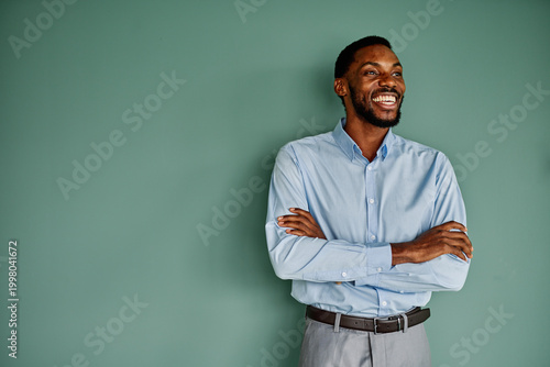 Cuadro en lienzo Portrait of a young happy businessman having a meeting or training in the office