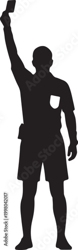 Silhouetted sports referee signaling a penalty or foul during a game