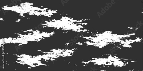 A monochrome view of clouds across the dark sky, an evocative, abstract image.