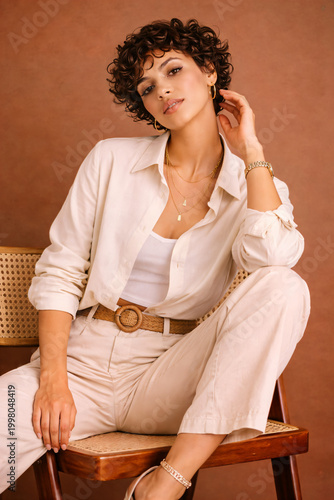 Stylish Portrait in Beige Outfit on Brown Background
