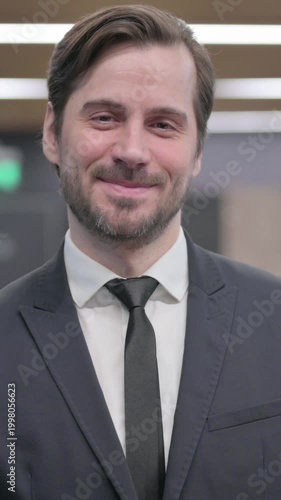 Portrait of Businessman Pointing at the Camera and Inviting, Vertical Video