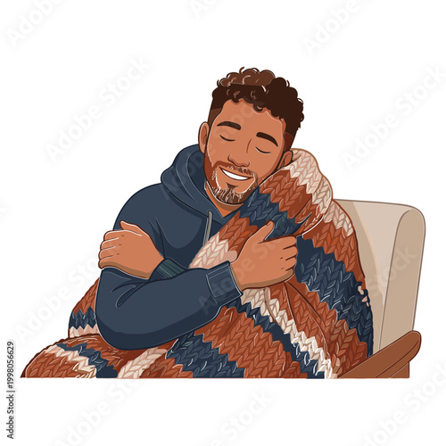 Man sitting on chair hugging blanket warmly indoors smiling