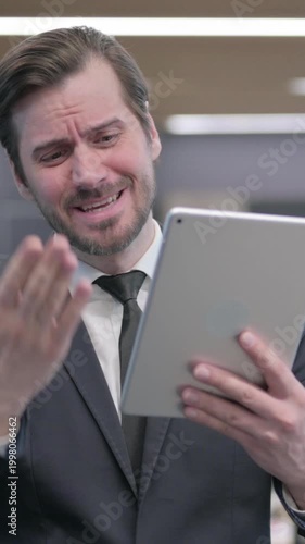 Portrait of Businessman having Loss on Tablet in Office, Vertical Video