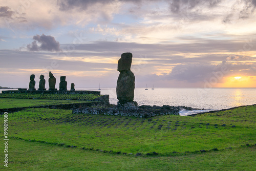 Photography Serene ancient moai statue faces golden sunrise on easter island chile