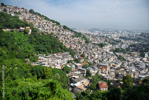 Vibrant cityscape of rio de janeiro displaying dense favela on lush green mountain slope overlooking urban skyline