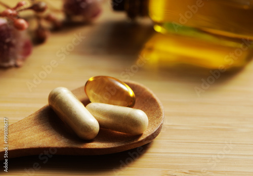 Pills. Medical. Wooden table. oil and vinegar. Diet. Vitamin. 