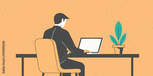 A man works diligently at his laptop in a minimalist office setup, focused on productivity.