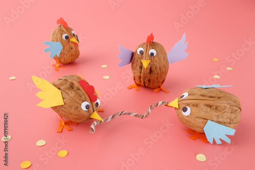 Fotografie Autumn seasonal crafts walnut birds chickens easter decoration thanksgiving tabl