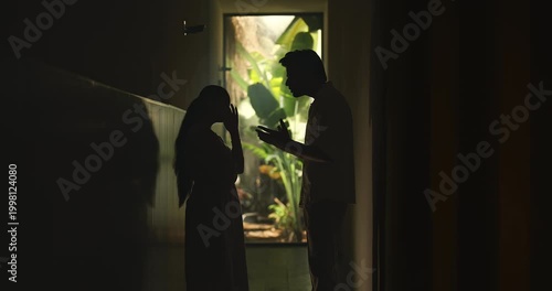 Indian upset tense young adult male female girl do fight argue shout on each other abuse living dark room place. Angry sad man woman wife couple talk speak lies feel bad have family issue money crisis