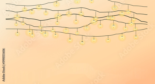 Wavy string lights in warm cozy lighting on peach background for festive decoration