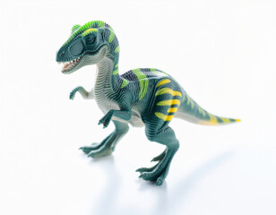 A detailed studio photograph of a small, vibrant green and yellow striped toy dinosaur with a white background