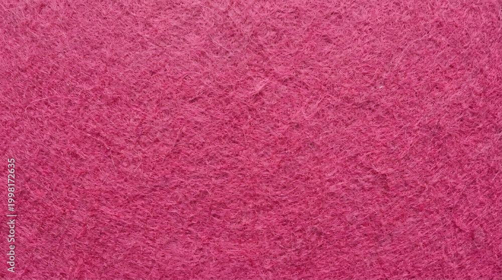Fototapeta premium Vibrant hot pink felt fabric texture close-up, showing soft fibrous surface with fuzzy fibers, ideal for craft, fashion, and textile design backgrounds.