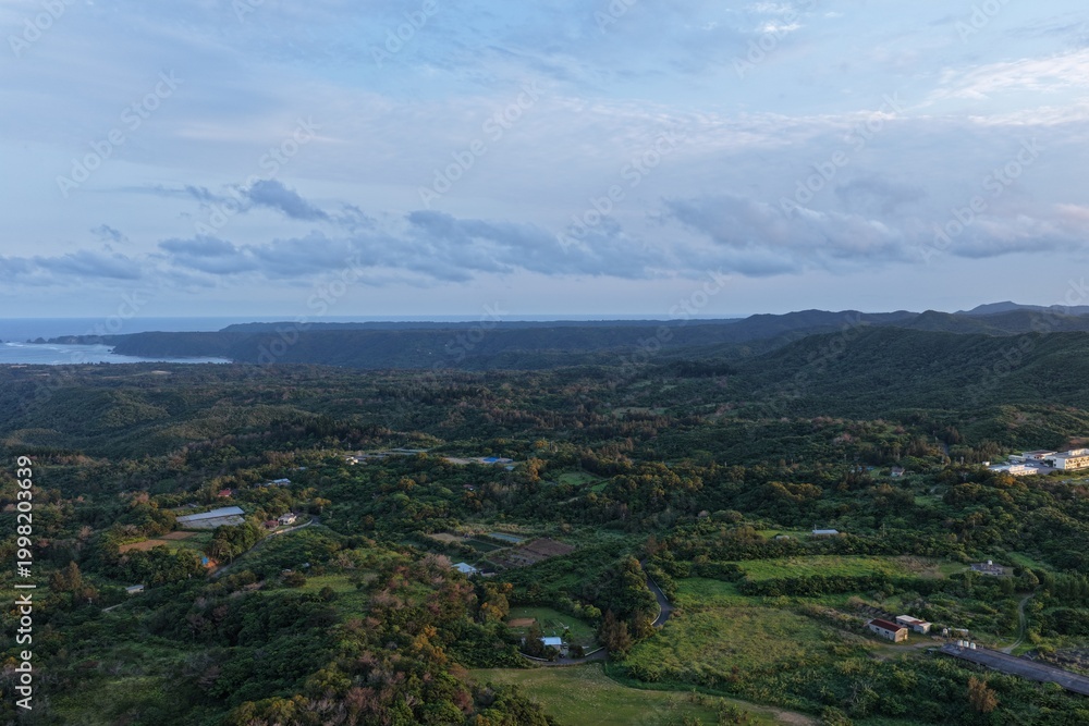 Obraz premium Aerial view of the Yanbaru forests and Higashi River basin in Higashi, Okinawa at sunset in April