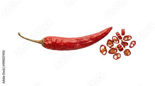 Isolated dried red chili pepper with cut slices and seeds on transparent background.