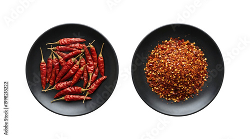 Whole dried red chili peppers and crushed flakes on black plates, isolated with transparent background.