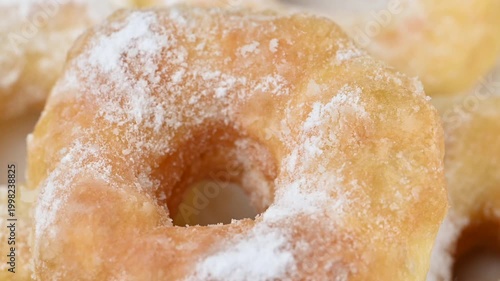  video of donuts coated in powdered sugar