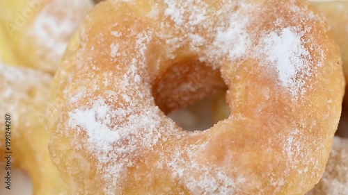  video of donuts coated in powdered sugar