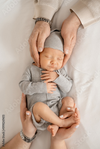 newborn baby in dad's arms, happy single father, young family with baby, fatherhood, father with infant.