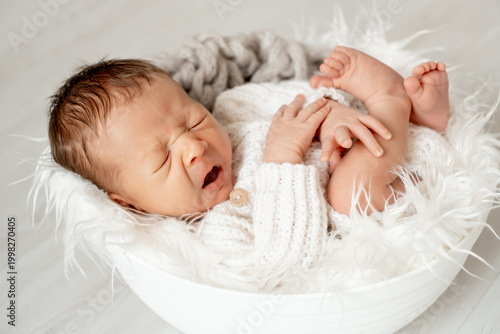 portrait of a yawning sleeping newborn baby, space for text, a little baby sleeping peacefully