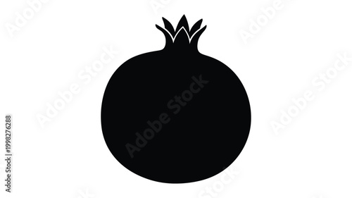 A striking black silhouette of a ripe pomegranate fruit
