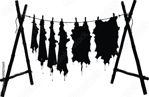 Black Silhouette of Animal Pelts Drying on a Rack