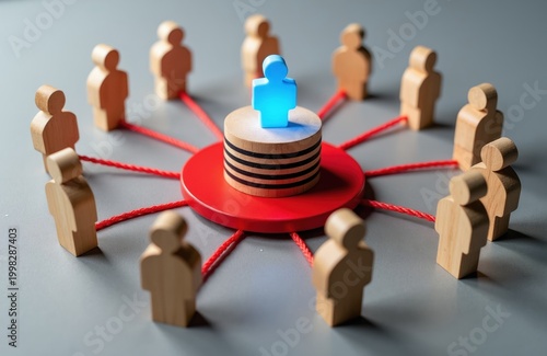 Wooden figures surround a glowing blue person on a central platform. Red lines connect everyone, showing a linked network. Teamwork, connection, and leadership concepts.
