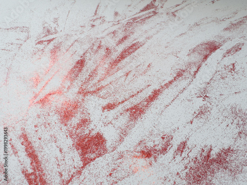 фотографія Abstract texture with red streaks on white surface