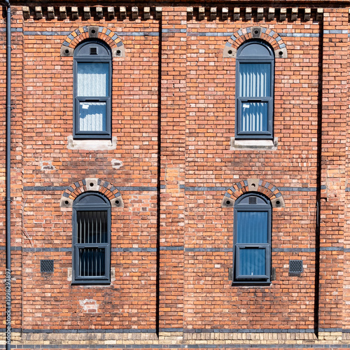 old brick wall with windows